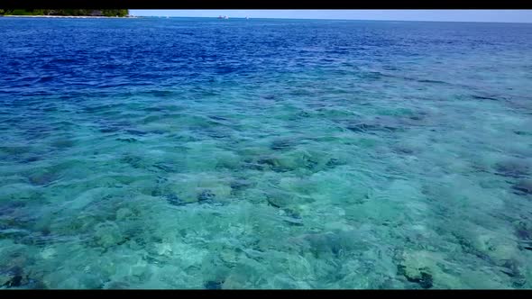 Aerial drone seascape of perfect seashore beach trip by aqua blue lagoon and bright sandy background