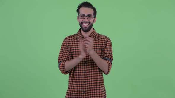 Happy Young Bearded Persian Hipster Man Clapping Hands