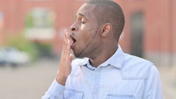 Tired African Man Sleeping Outdoor on Bench