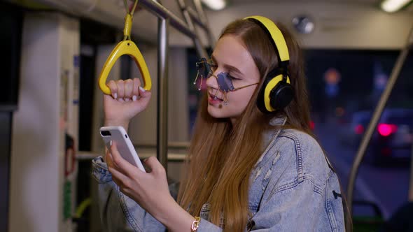 Young Woman Wearing Headphones Listening Music Funny Relax Dancing While Traveling By Bus to City