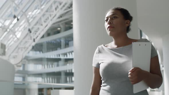 African Businesswoman Walking in Office Center