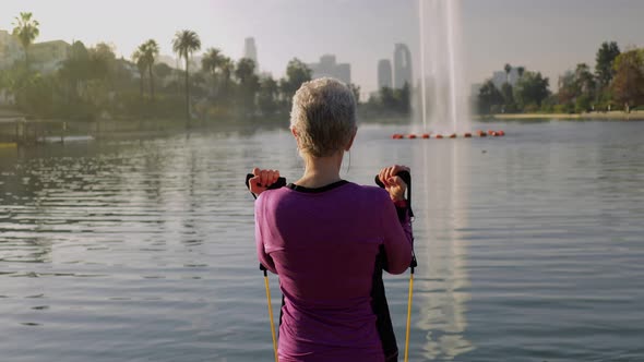 Senior Woman Working Out In The Park