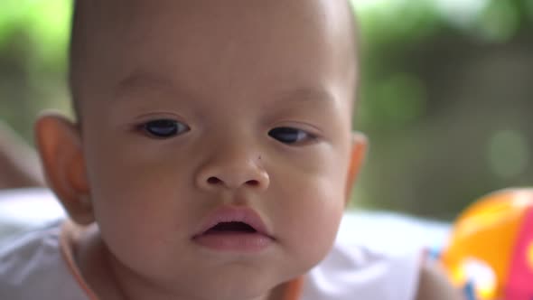 Happy portrait baby boy playing alone
