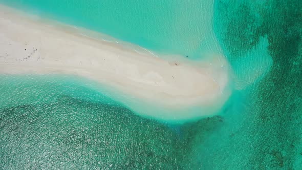 Beautiful above travel shot of a paradise sunny white sand beach and blue sea background 