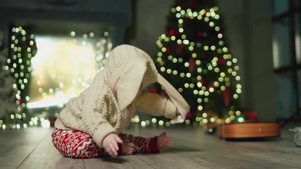 Baby in Rabbit Costume Pulls His Ears