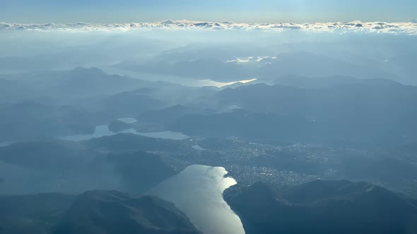 COCKPIT AERIAL - A pilots stunning view over Lake Maggiore in the Italian Alps