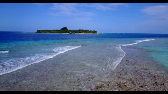 Aerial panorama of idyllic coastline beach adventure by blue sea and white sandy background of adven