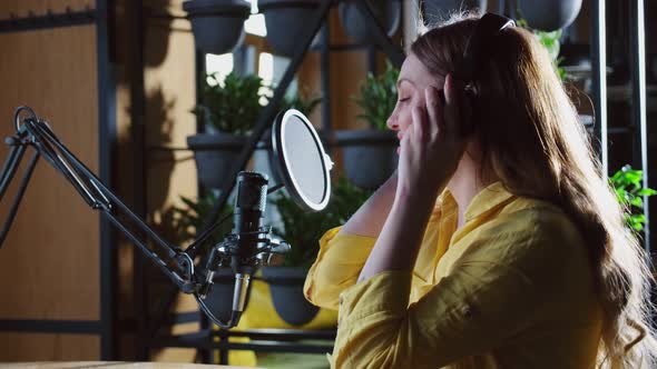 Young Beautiful Woman Singing and Recording Modern Songs