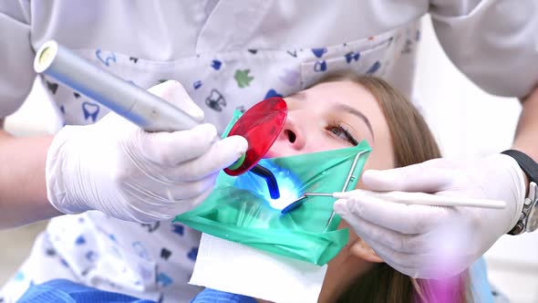 Dentist Working With Female Teeth