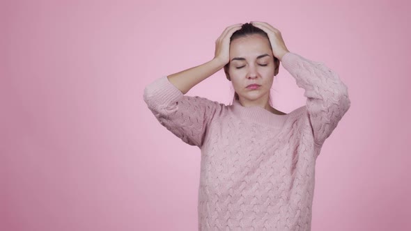 Woman Holding Her Head Trying To Eliminate the Severity of Headache 