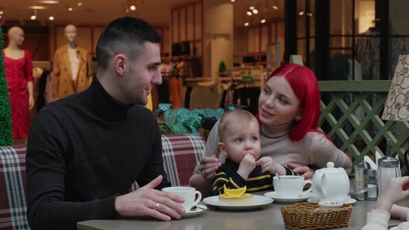 Beautiful Family Eating in a Cafe