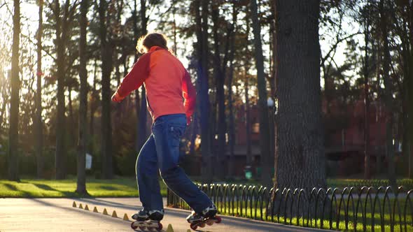 Bearded Man on Roller Skates Performs a Complicated Technique of Roller Skating, Performs Various