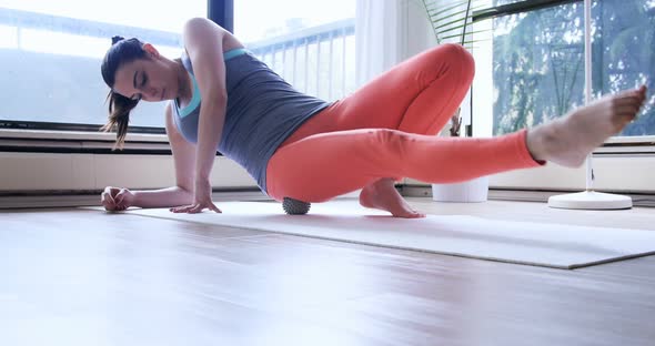 Beautiful woman exercising with stress ball