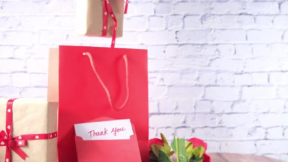 Thank you Message and Envelope on Wooden Table