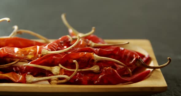 Dried chili pepper in wooden tray 4k