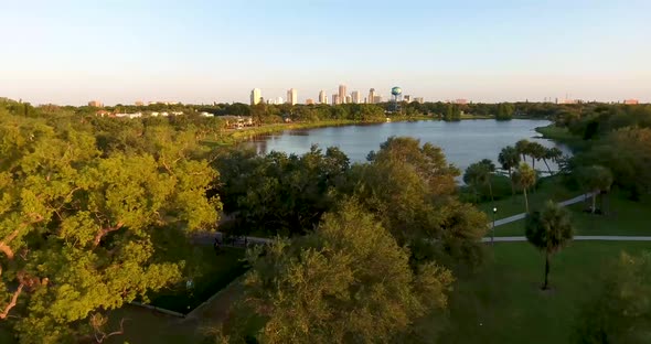 4K Aerial Video Landing By Trees and Lake With Downtown St Petersburg in Distance