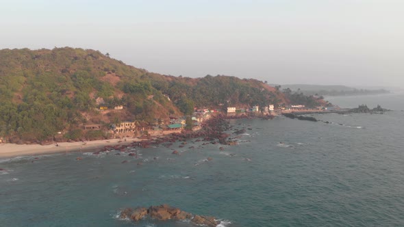 Aerial view of Arambol beach in Goa state, India. Calm ocean waves.