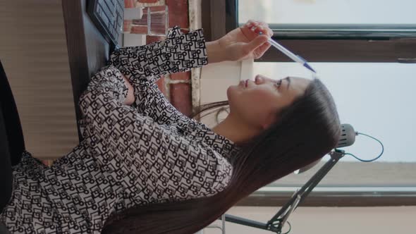 Vertical Video Pensive Worker Thinking About Business Strategy on Computer