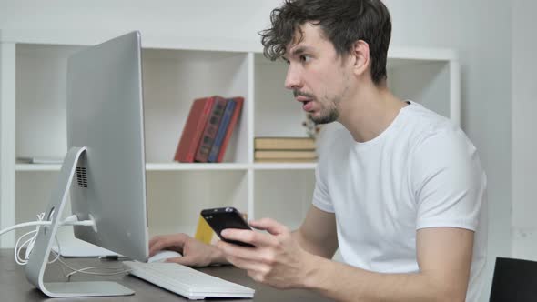 Young Man Using Smartphone, Text Messaging