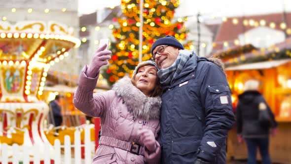 Senior Couple Taking Selfie at Christmas Market 5