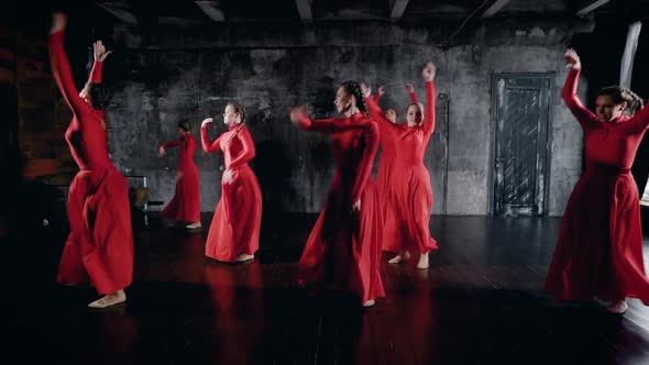 Modern Ballet Performed By Seven Dancers. Girls in Red Dresses 