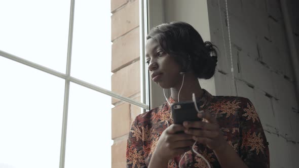 Young Black Woman Listening Music Travelling Looking Outdoor the Window, Pensive - Thoughtful