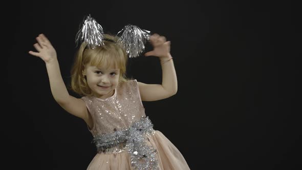 Happy Beautiful Little Baby Girl in Glossy Dress. Christmas. Make Faces, Dance