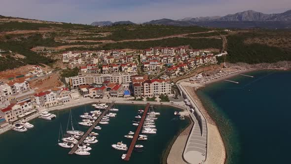 Drone View of the Houses and Wharf in the Lustica Bay