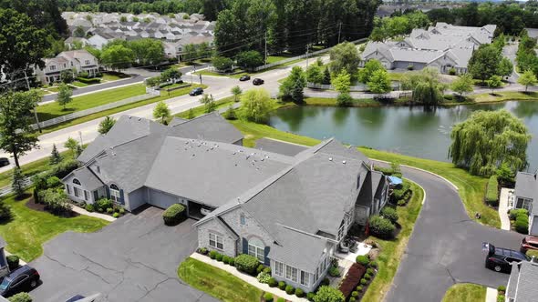 A slowly reversing aerial view of a typical Ohio mid-western residential neighborhood.