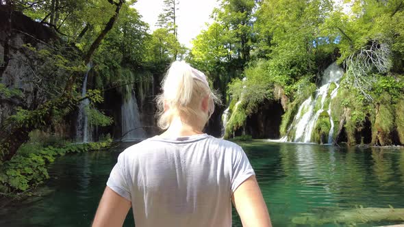 Woman Looking Waterfall in Plitvice Lakes National Park