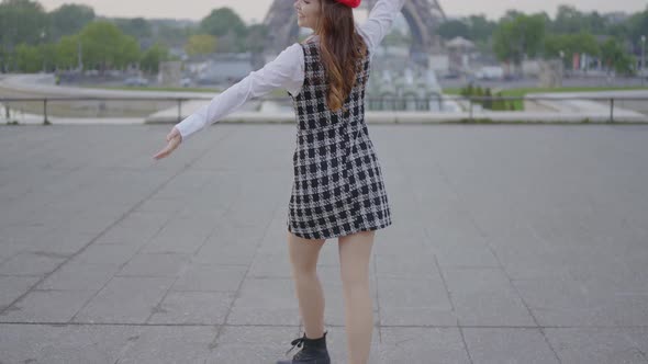 Beautiful young woman spending time in Paris.