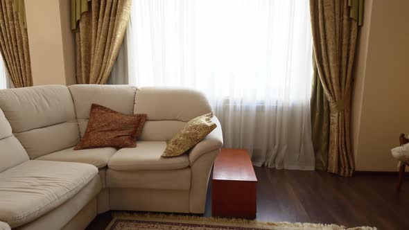 Corner Sofa in the Interior of a Large and Spacious Kitchenliving Room