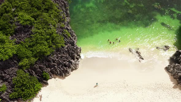 Tourists Relax on the Beach