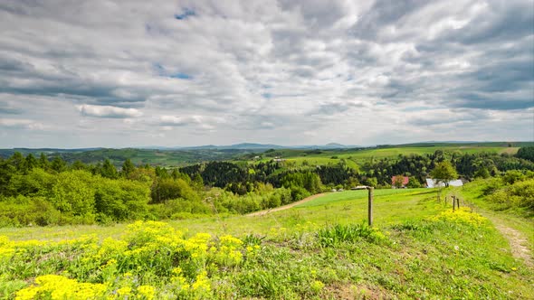 Rural Landscape And Green Rolling Hills At Sunny Day