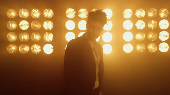 Man Model Showing Confidence Wearing Fashionable Clothes in Nightclub Close Up