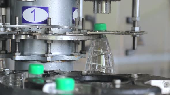 Water Bottling Line. Automatic Feeding of Plastic Caps and Closure