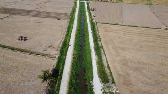 Aerial view farmer cycling at rural path