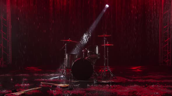 Abandoned Musical Instruments Lie on the Surface of the Water in the Rain