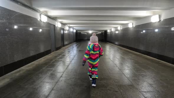 Little Independent Kid Walking Alone in Undeground Walkway