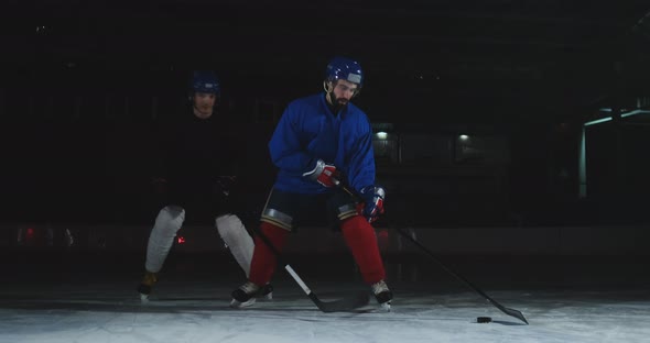 Professional Hockey Forward Technically Beats the Defender and Quickly Goes To the Hockey Goal.