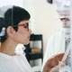 Beautiful Woman with Optician Trying Eyeglasses at Optics Store - VideoHive Item for Sale