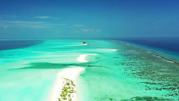 Aerial top down scenery of idyllic tourist beach time by transparent ocean and white sandy backgroun