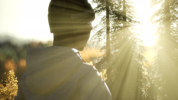 Young Woman Standing Alone Outdoor with Wild Forest Mountains