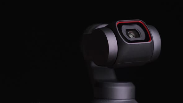 Mechanical Gimbal Camera Lens Rotates on Black Background Robotic Camera Macro