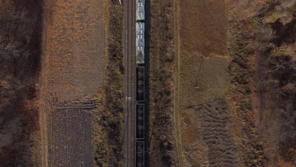 Locomotive Pulls Railway Freight Train with Wagons Filled Coal Top View of Train