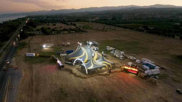 Big Top of a Circus with Caravans in a Field