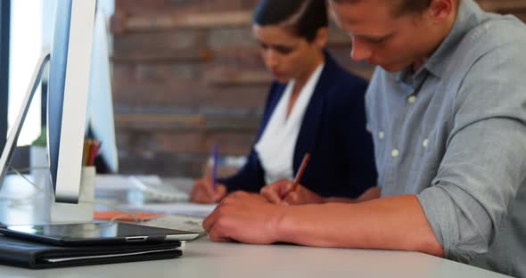 Business executives working at desk