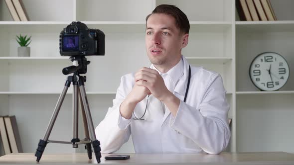 Doctor Videoblogger Records a Video Blog for the Internet a Medical Man Consults on the Internet on