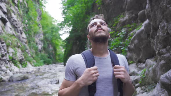 Lonely man in the canyon. Amazing nature.