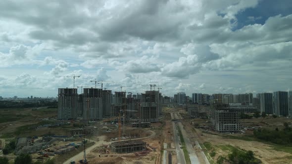 Construction site. Construction of multi-storey buildings. Construction of a city block. Aerial phot